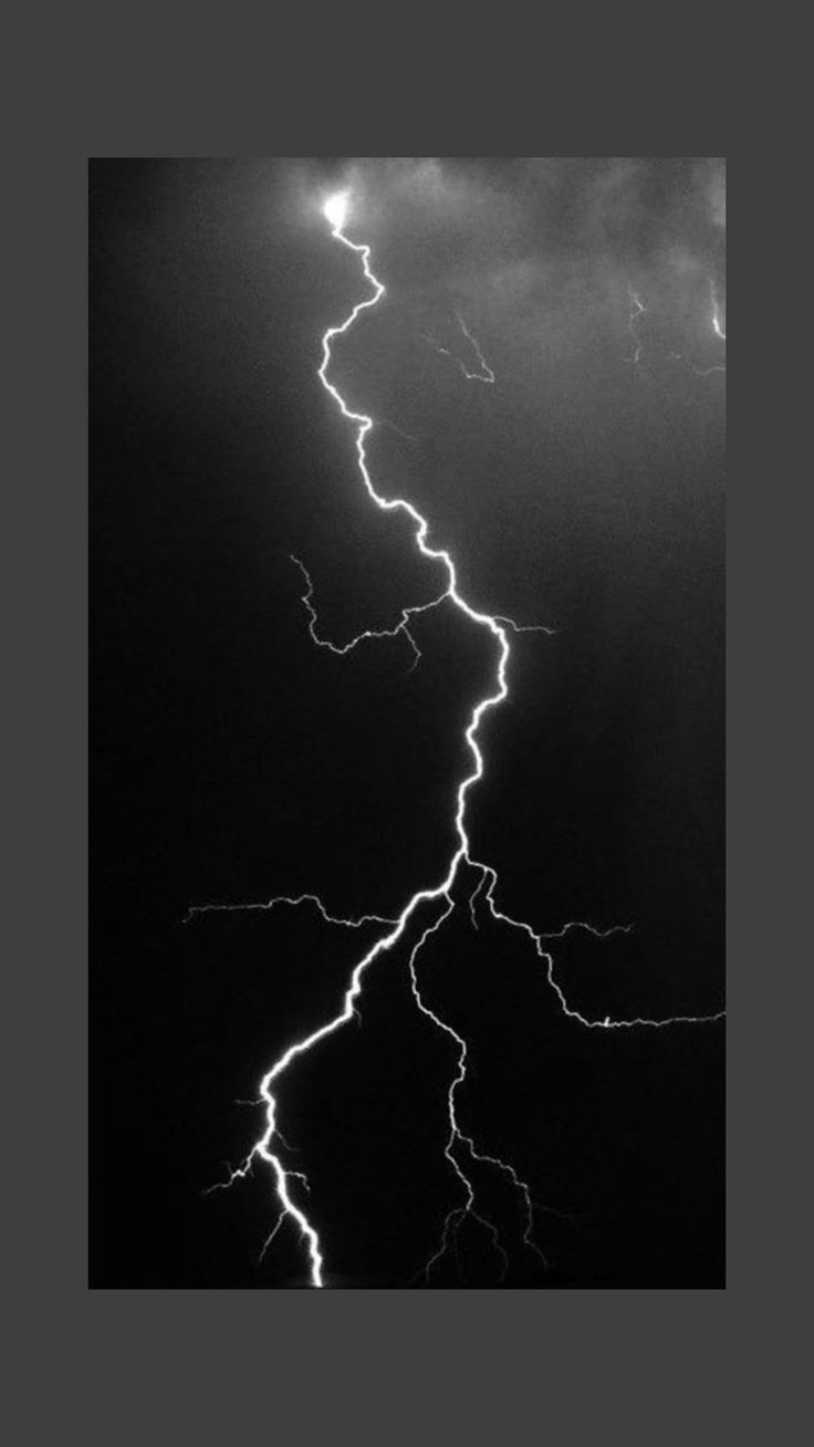 a black and white photo of lightning in the sky