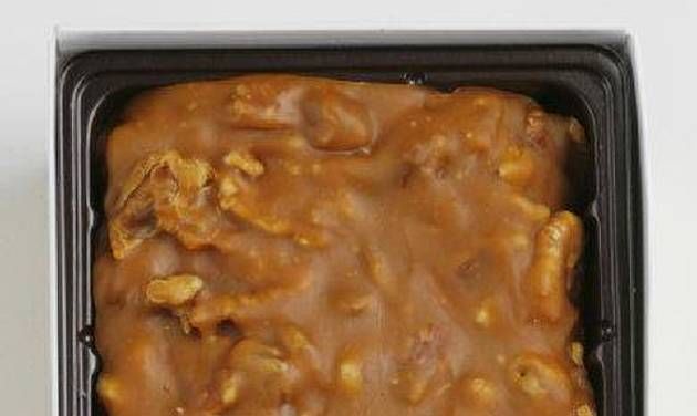 a pan filled with food sitting on top of a counter