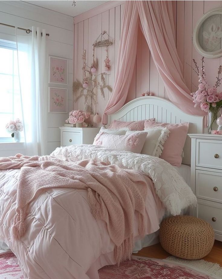 a bedroom with pink and white decor in the corner, curtains on the window sill