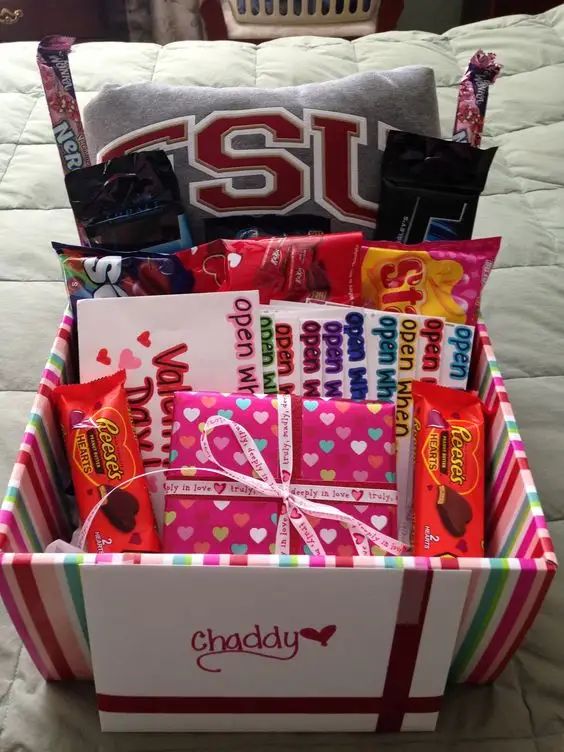 a gift box filled with candy and candies for someone's special birthday or valentine's day