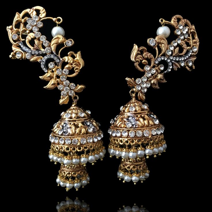 Inspired by the beautiful earrings Sonam Kapoor wore at the Cannes festival- we made another version and boy are they stunning!Made on brass and then gold and rhodium plated. Gold Metal Ear Cuff For Wedding, Silver Gold-plated Earrings With Stone Work, Gold Earrings With Stone Work, Gold Chandelier Earrings With Stone Work, Gold Fusion Chandelier Earrings With Stone Work, Gold Jeweled Bridal Earrings For Reception, Festive Metal Pearl Earrings For Pierced Ears, Elegant Metal Ear Cuff For Weddings, Bollywood Style Metal Earrings With Stone Work