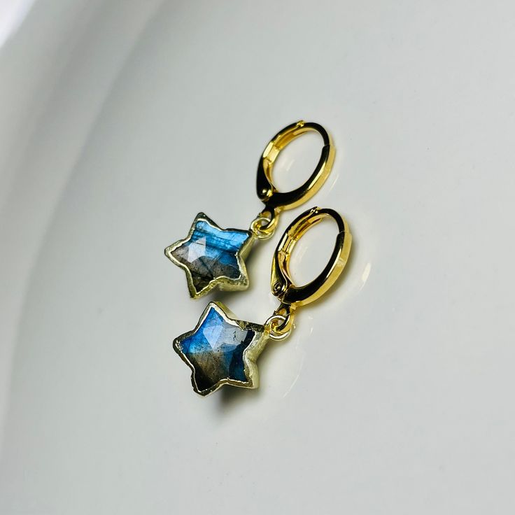 ✵ Listing is for one pair of  earrings ✵10 x 10mm Labradorite  ✵Gold-plated charm ✵12mm x 14mm 24k gold-plated earrings ✵Lever-back small hoops ✵Please note: these gemstones are natural, therefore, will be unique in size, color, and texture. However, I will do my best to find pair up the most similar stones ✵Packaged in gold tissue paper with recyclable earring card holders, receipt included upon request  ✵Dainty, classy, and minimalistic style ✵Get the set! Link below to the necklaces: https:// Celestial Star Huggie Earrings, Celestial Dangle Huggie Earrings For Gift, Celestial Dangle Huggie Earrings As Gift, Handmade Dainty Star Earrings, Yellow Gold Star Huggie Earrings For Gift, Celestial Star-shaped Hypoallergenic Earrings, Celestial Star Hypoallergenic Earrings, Round Star Charm Earrings For Gift, Celestial Earrings With Star Charm As Gift