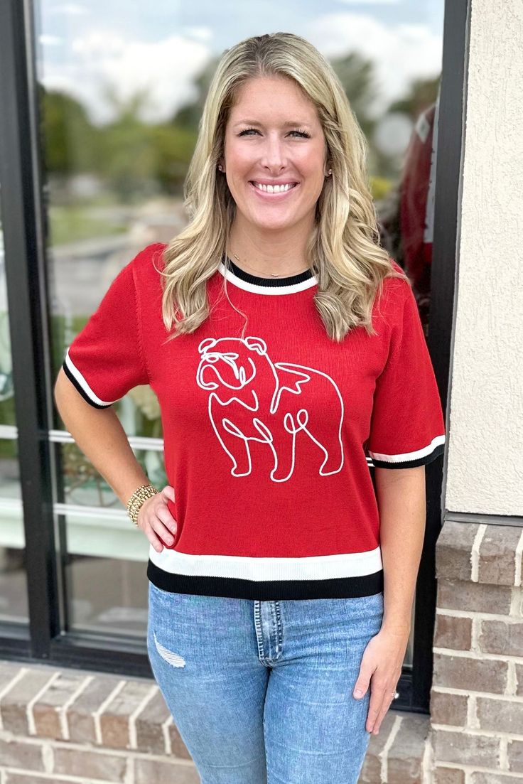 Elevate your game day look with the Georgia Bulldogs Short Sleeve Sweater from Walker Boutique! Made with lightweight material, this sweater offers amazing quality while showing off your team spirit. Whether you're cheering from the stands or watching from home, this sweater is the perfect addition to your game day wardrobe. Go Dawgs! Kelcie is 5'6 and wearing a size medium. Fits true to size. Go Dawgs, Short Sleeve Sweater, Georgia Bulldogs, Short Sleeved Sweaters, Team Spirit, Sleeve Sweater, Game Day, From Home, Bulldog