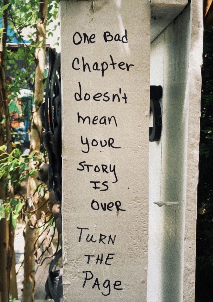 graffiti on the side of a building that says one bad charter doesn't mean your story over turn the page