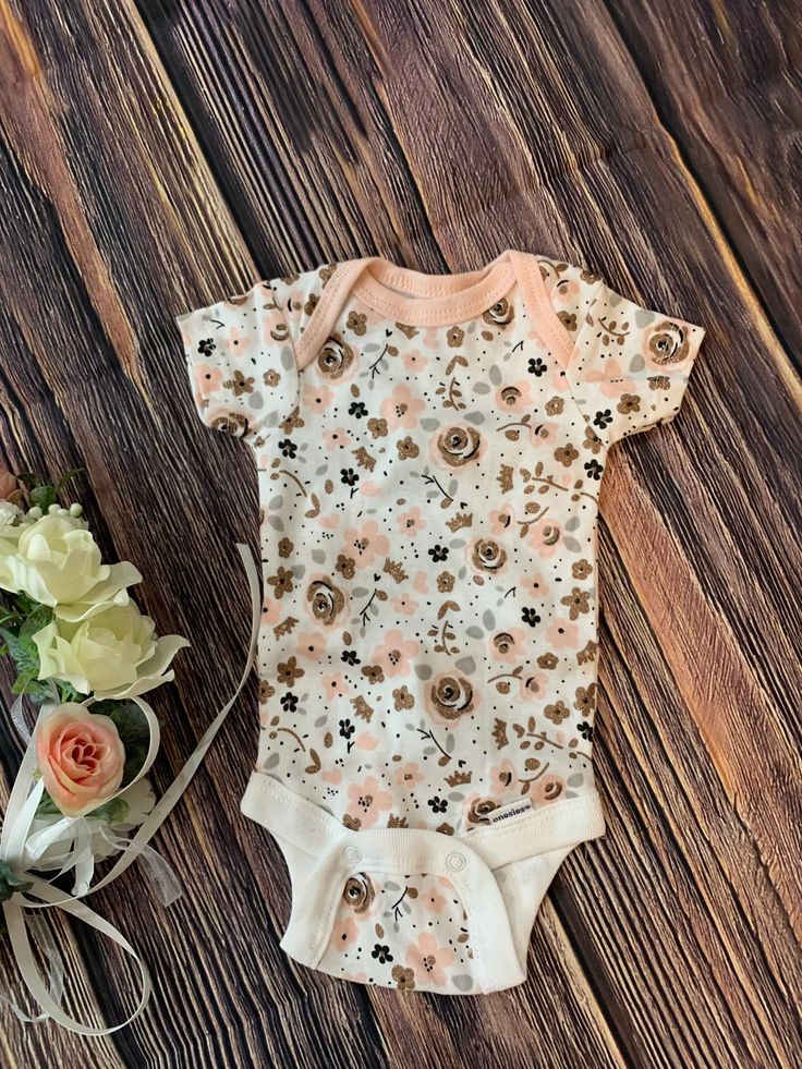 Tiny comfortable baby bodysuit for PreemieFloral designOnly 1 available Pink Fitted Printed Onesie, Fitted Floral Print Onesie For Summer, Cute Floral Print Bodysuit For Spring, Cute Fitted Printed Onesie, Spring Cotton Bodysuit With Floral Print, Pink Cotton Onesie With Floral Print, Pink Floral Cotton Onesie, Spring Floral Print Cotton Bodysuit, Pink Floral Print Cotton Onesie