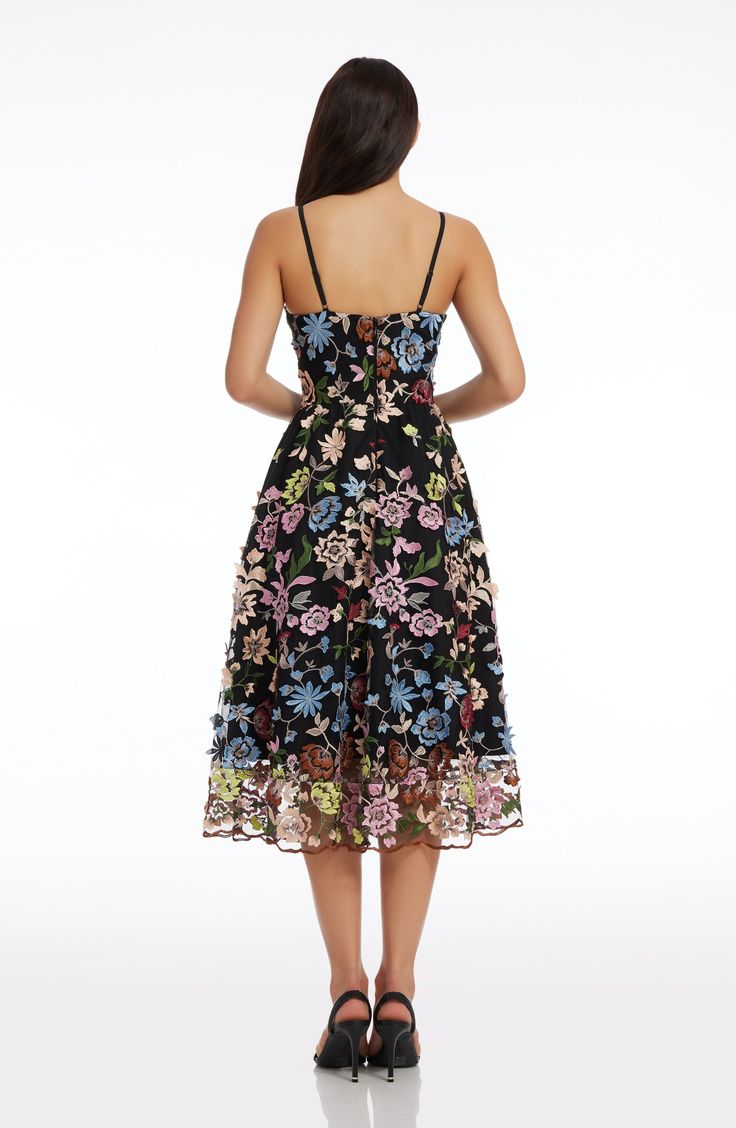 A lush garden scene is embroidered all over this figure-flattering dress in Black Multi. The Maren is topped with a slim, plunging bodice and finished with a breezy, flared skirt.