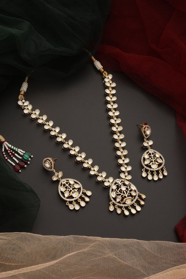 Make a bold statement with this Red Polki Necklace set, masterfully crafted with radiant red stones set in intricate Polki design and adorned with a luxurious gold finish. Paired with matching earrings, this necklace set is perfect for weddings, festive occasions, or any special event where you want to shine with classic sophistication. Red Kundan Necklace For Party, Red Ruby Kundan Necklace For Wedding, Formal Red Kundan Necklace, Festive Red Hand-set Kundan Necklace, Elegant Red Kundan Gold-plated Necklace, Chain Braid, Hand Jewelry Rings, Polki Necklace, Hand Jewelry