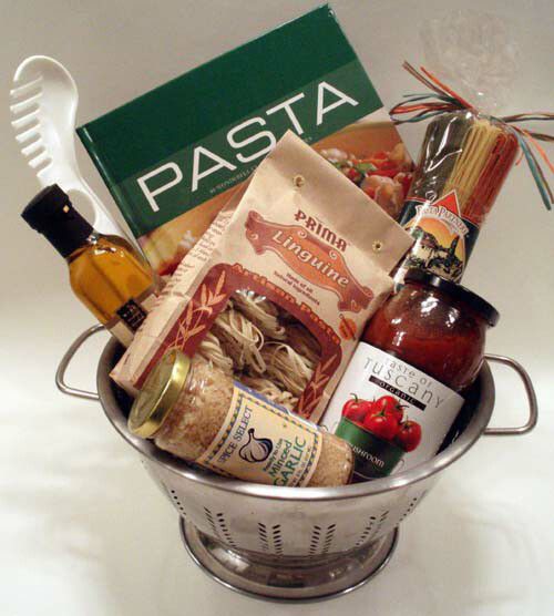 a silver colander filled with pasta and condiments