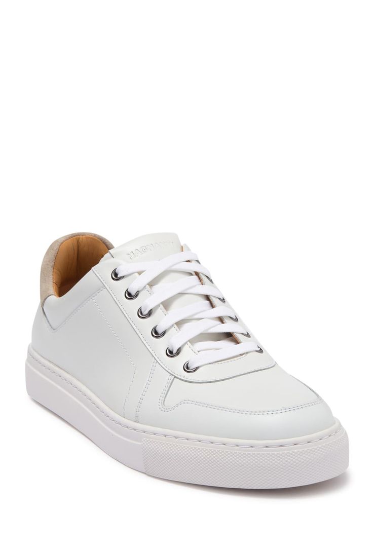 White shoes always add a fresh and clean look to an outfit. This leather sneaker is sporty yet classy with contrasting suede details and sleek silhouette.Sizing: True to size. Round toe. Leather construction. Suede heel detail. Lace-up closure. Padded footbed. White sole. ImportedOrders cannot be shipped to Canada, Alaska, Hawaii, Puerto Rico or P.O. Boxes. Classic White Lace-up Platform Sneakers, Modern Lace-up Sneakers With Stitched Sole, White High-top Sneakers For Streetwear With Stitched Sole, White Platform Sneakers With Contrast Sole For Light Sports, White Lace-up Sneakers With Gum Sole, White Low-top Sneakers With Stitched Sole, White Platform Sneakers For Light Sports With Textured Sole, High-top Custom Sneakers With Stitched Sole For Sports, High-top Custom Sneakers For Sports With Stitched Sole