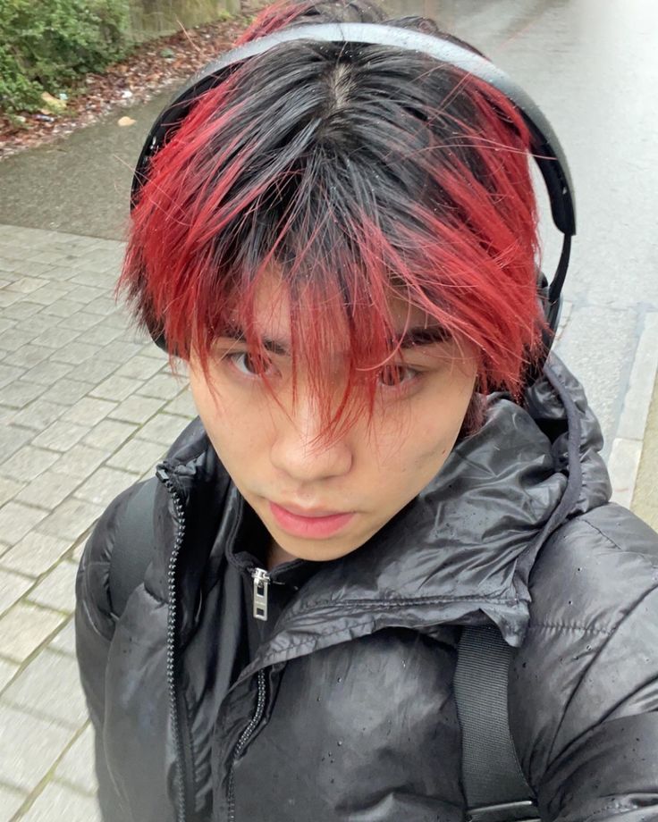 asian handsome model with red hair in the raib wearing a ouffer jacket Black Hair Red Tips, Black Roots Red Hair, Pelo Color Borgoña, Black Hair With Red Highlights, Boys Dyed Hair, Red Hair Tips, Red Hair Boy, Boys Colored Hair, Fade Hairstyle