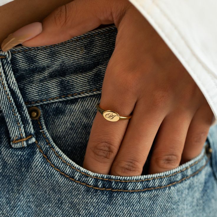 Our stunning oval signet ring is the perfect addition to any jewelry collection, with an unqiue engraving that brings a personal touch to this timeless piece. Thick layer of 14K Gold over Sterling Silver Hypoallergenic, lead and nickel free Made in NYC Side Oval width 8mm x Height 5mm Band Thickness 2mm #R009-G Dainty Gold Ring With Engraving Option, Dainty Adjustable Engraved Signet Ring, Dainty Gold Engraved Ring With Engraving Option, Oval 14k Gold Stamped Signet Ring, Oval Stamped 14k Gold Signet Ring, Adjustable Oval Gold Engraved Ring, Oval Yellow Gold Stamped Ring, Dainty Oval Initial Ring In 14k Gold, Adjustable Oval Signet Ring For Everyday