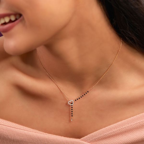 New Mangalsutra Designs For The Millennial Bride Mangalsutra Chain, Delicate Gold Jewelry, Black Beads Mangalsutra, Black Beads Mangalsutra Design, Diamond Pendants Designs, Diamond Mangalsutra, Fancy Jewelry Necklace, Gold Mangalsutra Designs, Jewelry Set Design