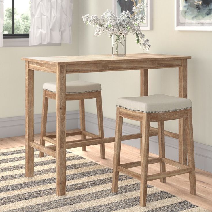 two stools and a table in a room