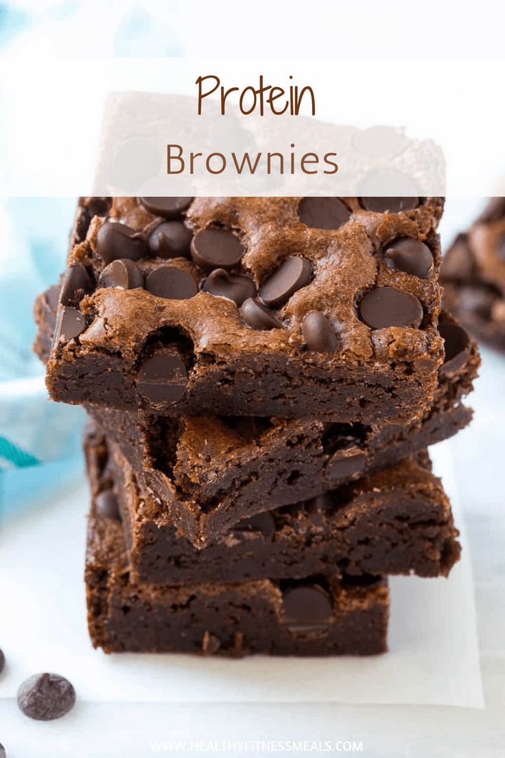 three chocolate brownies stacked on top of each other next to a cup of milk