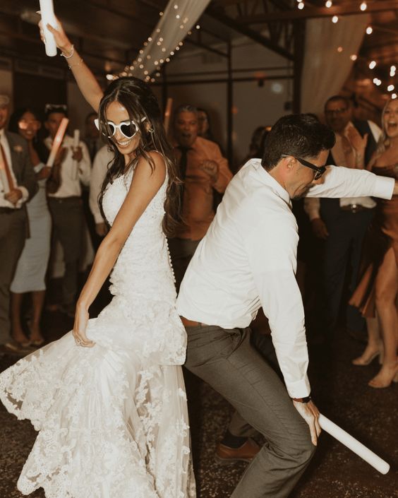 a bride and groom dancing on the dance floor