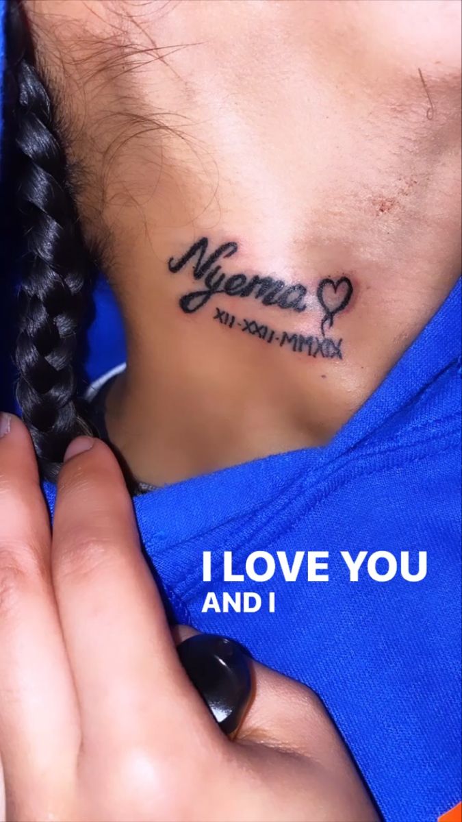 a woman with a tattoo on her neck saying i love you and i