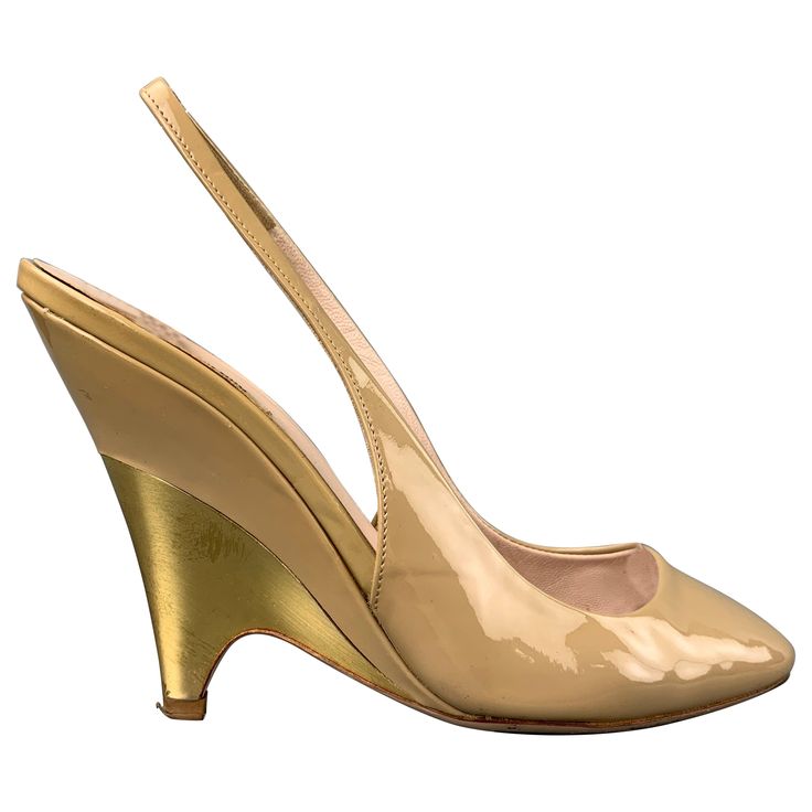 MIU MIU pumps comes in beige patent leather with a gold tone heel featuring a slingback. Made in Italy. Good Pre-Owned Condition. Marked: EU 35.5 Measurements: Heel: 4 inches Reference: 108121 Category: Pumps More Details Brand: MIU MIU Size: 5.5 Color: Beige Color 2: Gold Pattern: Solid Type of Leather: Patent Leather Style: Slingback Age Group: Adult Gender: Female Miu Miu Pumps, Miu Miu Heels, Miu Miu Sandals, Century Shoes, Fabric Sandals, Lace Up High Heels, Miu Miu Shoes, Peep Toe Shoes, Patent Leather Pumps