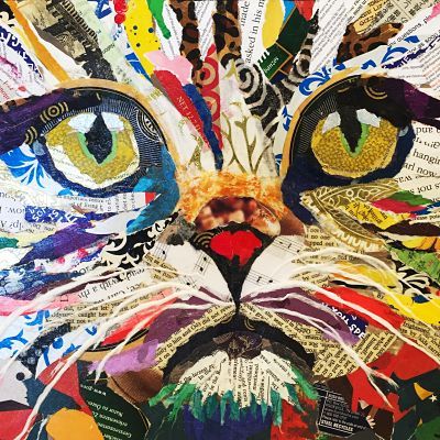 a close up of a cat made out of different types of paper and colored images