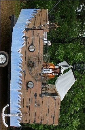 an overhead view of a wooden table with white cloth on it