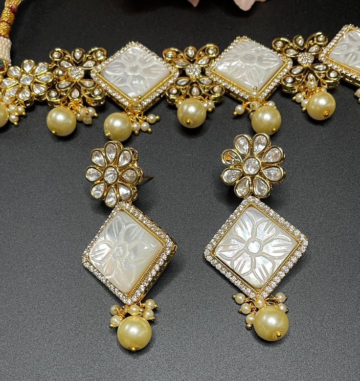 This elegant and gorgeous choker with matching earrings and is sure to be a hit for any event! The beautiful ivory color with gold pearls can match any outfit and the color is a gorgeous shade with a beautiful finish. Bridal Choker, Dainty Choker, Indian Wedding Jewelry, Gold Pearl, Ivory Color, Indian Bridal, Matching Earrings, Indian Wedding, Mother Of Pearl