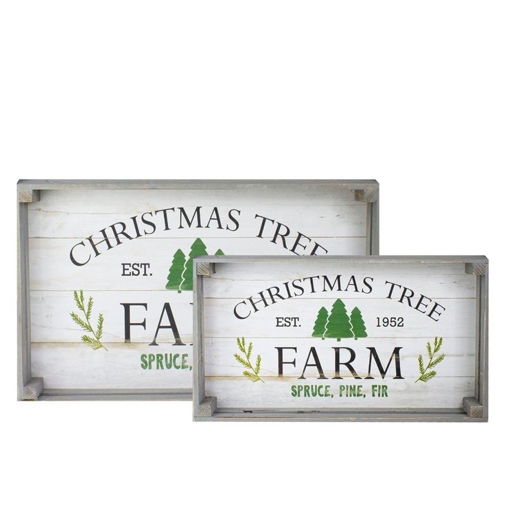 two wooden signs with christmas trees and farm service written on the front, one in white