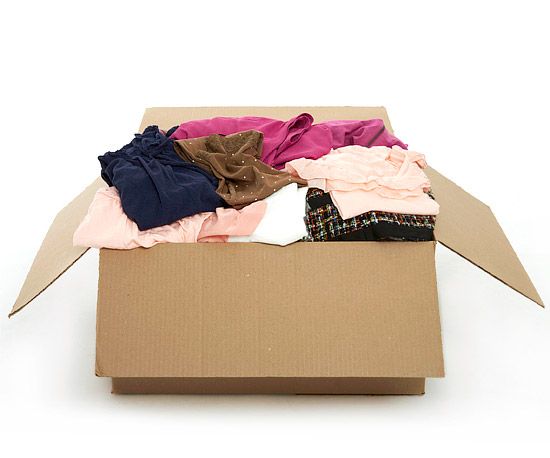 an open cardboard box with clothes in it