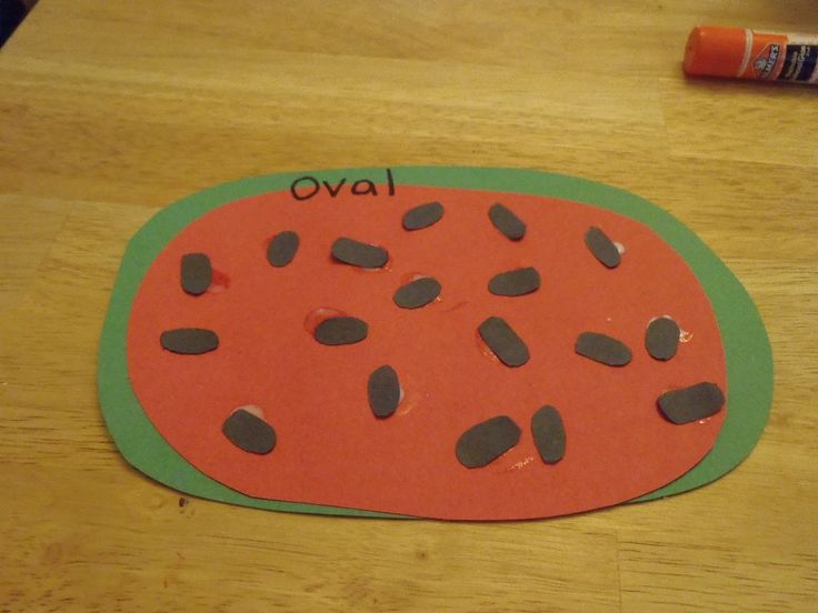 a piece of paper cut out to look like a watermelon with the word ova on it