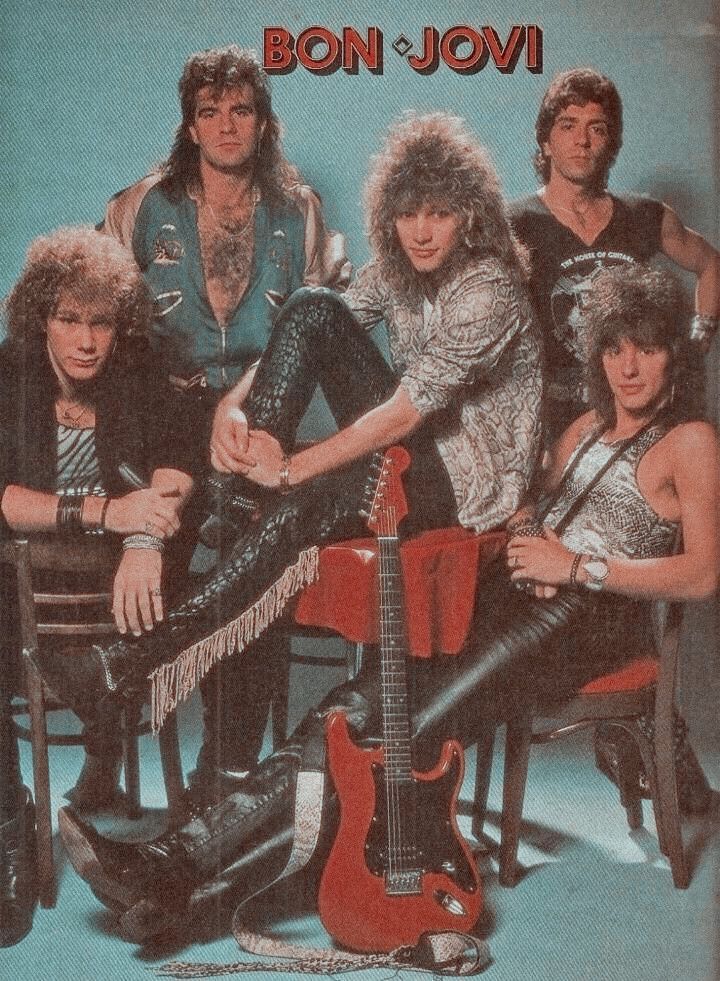 the band bon - jovi is posing for a photo with their guitars and guitar