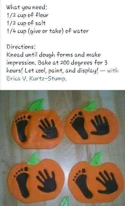 four pumpkin shaped cookies with hand prints on them