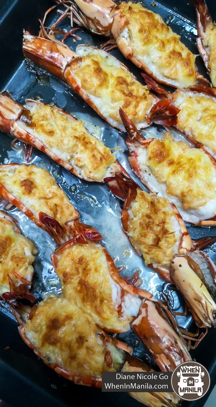 cooked lobsters in oil and butter on a baking sheet, ready to be served