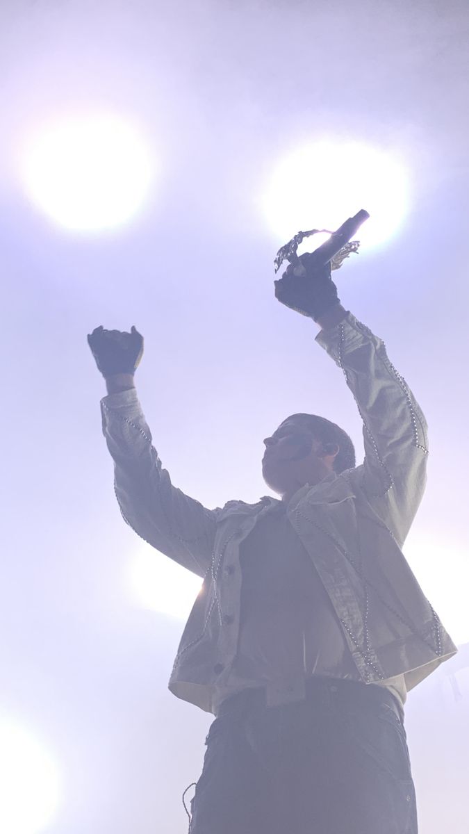 a man with his hands up in the air