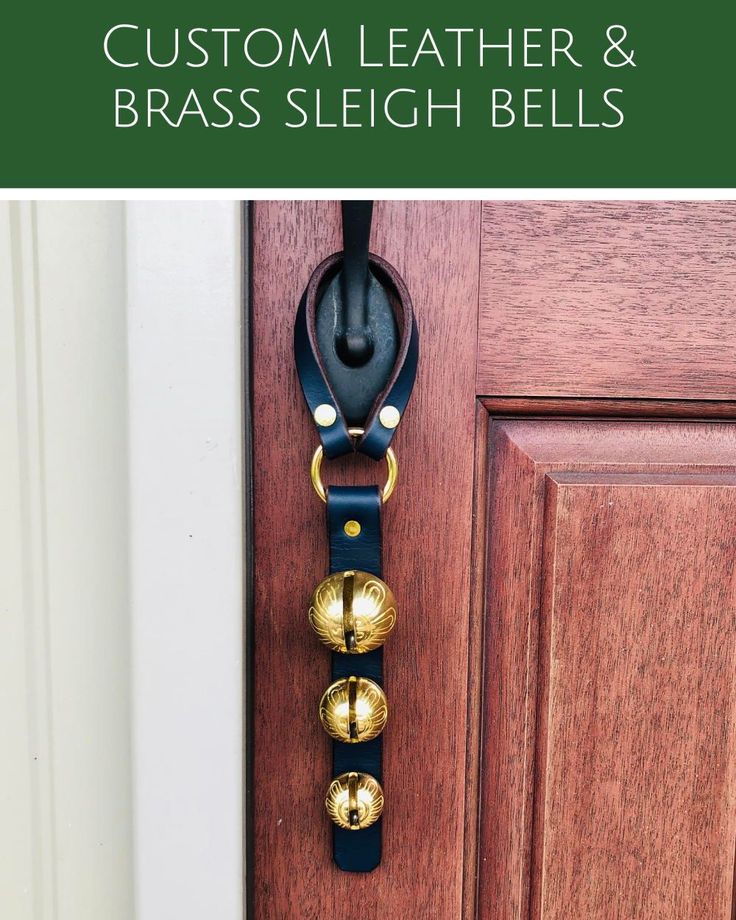 leather and brass bells hang on the front door with text overlay that reads, leather & brass sleigh bells