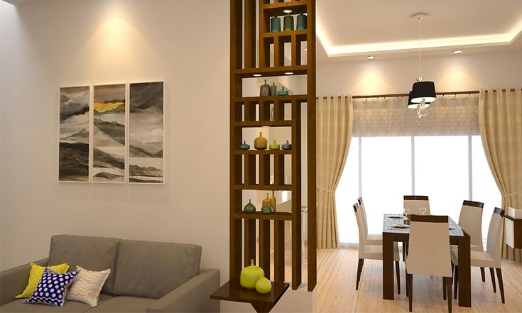 a living room filled with furniture and a tall wooden shelf next to a dining table