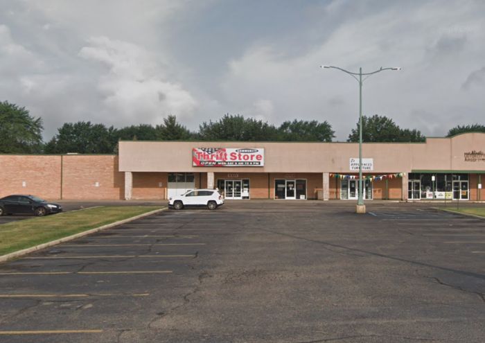 an empty parking lot in front of a store