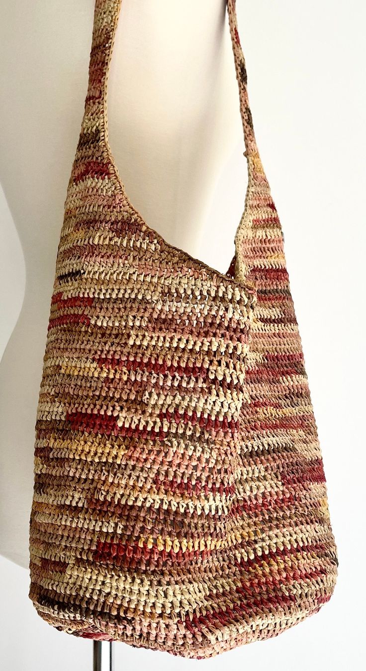 Slouchy Helen Kaminski desert tone woven raffia bag Open top.  No closure.  Interior pocket Measurements: Length: 13" Height: 10-1/2" Base diameter: 10" Strap length: approx. 25" Photographed on a size 2/4 dress form Good vintage condition with clean interior and minor fading.  Please note the raffia at the top of the shoulder is fraying which you can see in the last two photos. NOTE: Please bear that in mind that, when you purchase vintage, it might not be perfect, but it will be authentic.  No American Vintage Clothing, Beach Market, Helen Kaminski, Woven Raffia, Raffia Bag, Zara Kids, Hobo Handbags, Market Bag, Open Knit