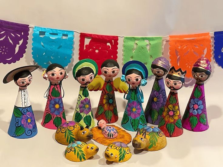 a group of colorful figurines sitting next to each other on a white surface