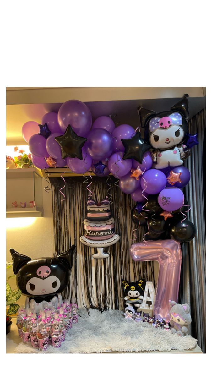 a birthday party with hello kitty balloons and decorations