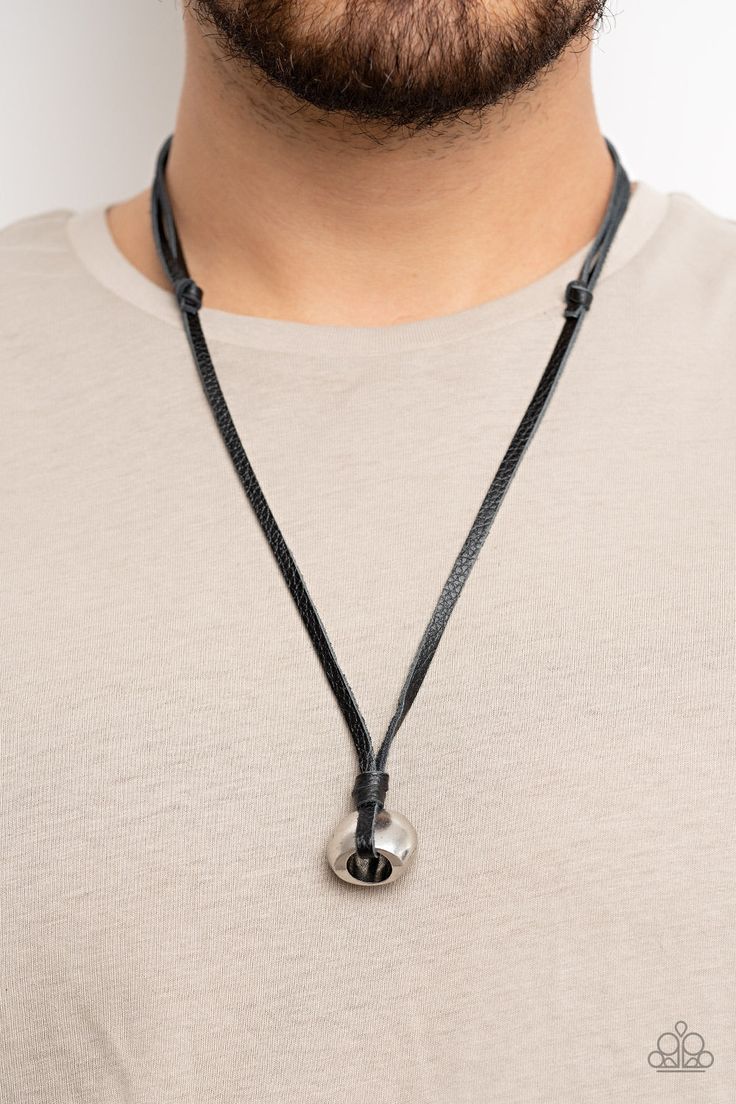 A chunky silver bead is knotted in place at the bottom of black leather laces, resulting in an urban pendant. Features an adjustable sliding knot closure. Sold as one individual necklace. Silver Necklaces With Adjustable Length And Waxed Cord, Silver Necklace With Adjustable Length And Waxed Cord, Black Casual Necklace With Adjustable Cord, Casual Black Necklace With Adjustable Cord, Silver Casual Necklace With Adjustable Length, Casual Silver Necklace With Adjustable Length, Casual Adjustable Jewelry With Round Pendant, Casual Adjustable Necklace With Round Pendant, Casual Adjustable Necklace With Sliding Knot