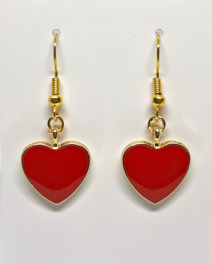 Beautiful red heart shaped earrings perfect for any occasion. Valentine's Day Heart-shaped Jewelry With Matching Earrings, Red Double Heart Earrings With Heart Beads, Nickel-free Heart Pendant Earrings For Valentine's Day, Trendy Heart-shaped Earrings For Gifts, Trendy Heart Shaped Earrings For Gifts, Red Heart Beads Earrings For Valentine's Day, Red Heart Pendant Earrings, Red Heart Charm Earrings As Gift, Red Heart Charm Earrings For Gift