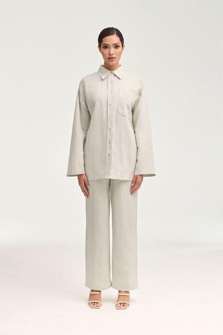 Introducing the Adalila Linen Button Down Top in Oatmeal. Crafted from luxurious linen, this top exudes effortless elegance with its classic button down design and straight sleeves. Comfort meets sophistication, making it a must-have for any wardrobe. Model is 5'7" and is wearing size XS. Beige Linen Button-up Shirt, Linen Button-up Shirt For Daywear, Linen Shirt With Button Cuffs For Daywear, Neutral Collared Linen Shirt, Classic Neutral Linen Tops, Flax Linen Top With Button Closure, Classic Neutral Linen Top, Neutral Linen Button-up Top, Beige Linen Blouse With Button Closure