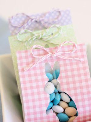 three small bags with candy in them on a table