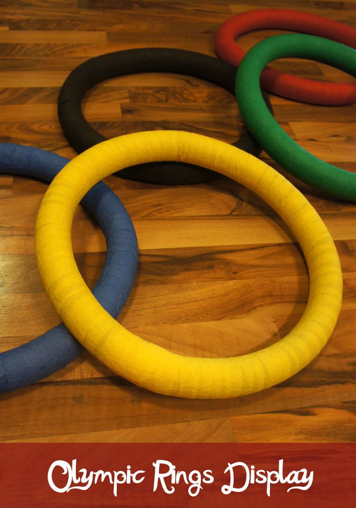 the olympic rings display is laid out on the wooden floor and ready to be played