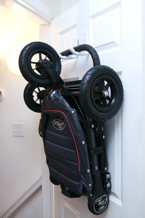 an image of a small space living with wheels attached to the back of a stroller