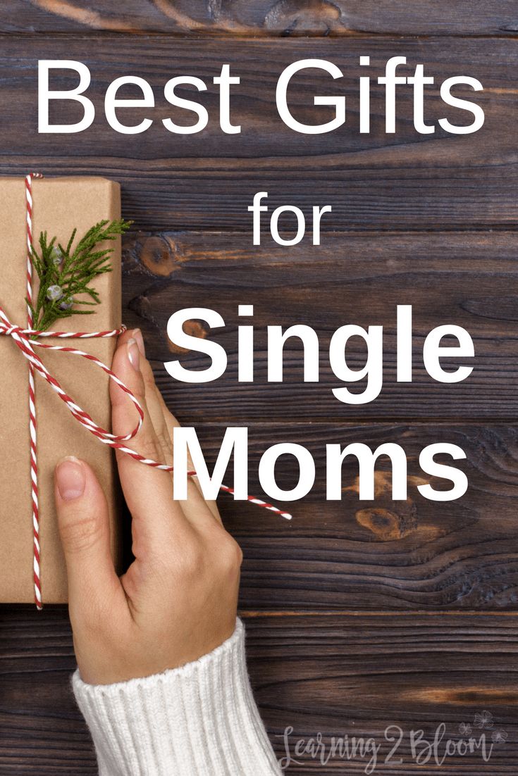 a person holding a wrapped present with the words best gifts for single moms