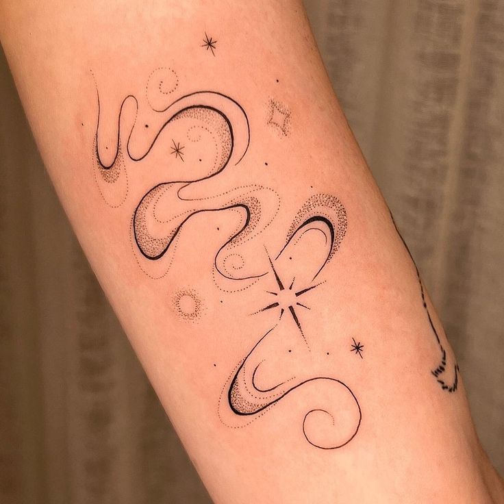 a woman's arm with the word love written in cursive writing on it