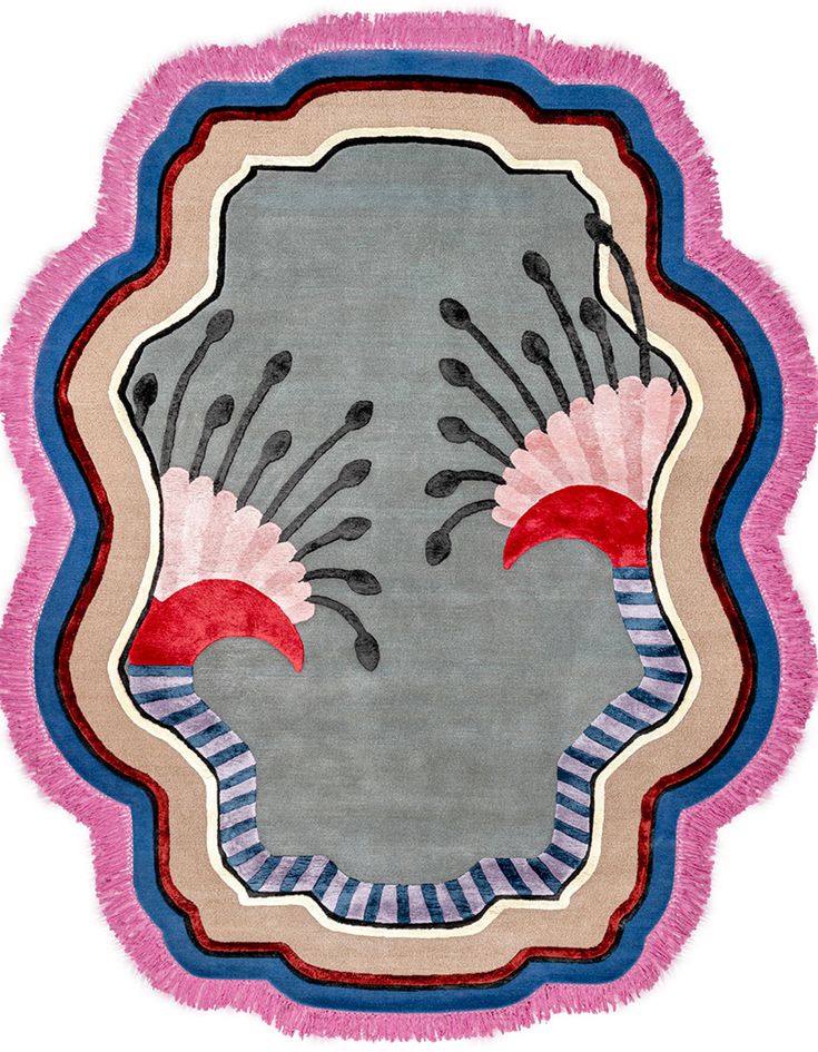 an oval rug with pink, blue and grey designs on the edges is shown in front of a white background