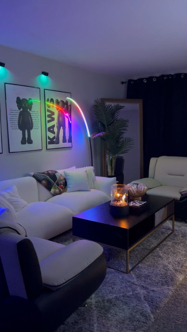 a living room filled with furniture and colorful lights