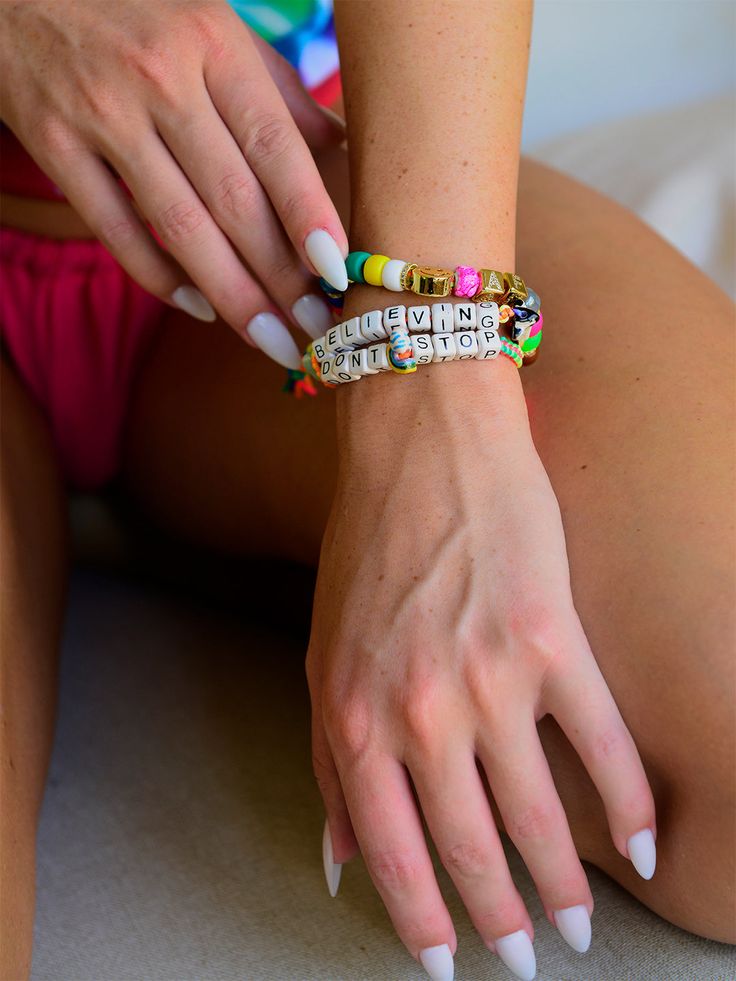 Are you feeling Happy AF? Show it off with this cheery rainbow bracelet! Featuring bright rainbow glass charms, dazzling pave rhinestone accents, and a smiley face, this bracelet will bring a smile to anyone nearby and give you some seriously good vibes. Ready, set, RAINBOW! 6" Adjustable rainbow threadwork Drawstring closure (extendable up to 8") Gold plated brass hardware Glass charms Pave rhinestones Handmade in New York City and Puerto Rico. Due to the handmade nature of our products, some c Playful Rainbow Jewelry With Letter Beads, Trendy Rainbow Jewelry For Friendship, Everyday Rainbow Bracelets With Letter Beads, Rainbow Letter Beads Bracelets, Trendy Personalized Rainbow Beaded Bracelets, Fun Rainbow Beaded Bracelets With Letter Beads, Colorful Personalized Jewelry For Friendship, Cheerful Multicolor Jewelry For Friendship, Colorful Personalized Friendship Jewelry