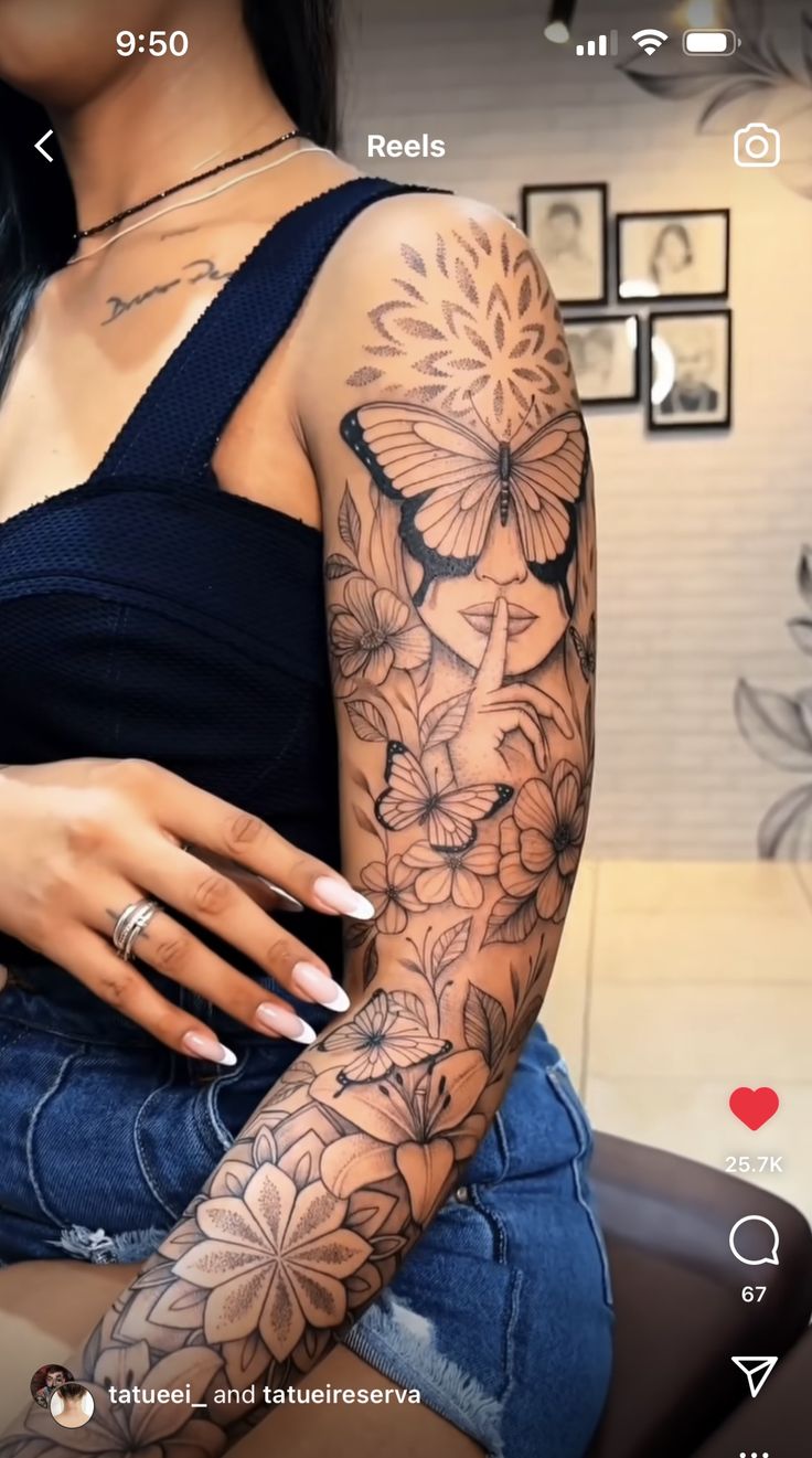 a woman with tattoos on her arm sitting in a chair