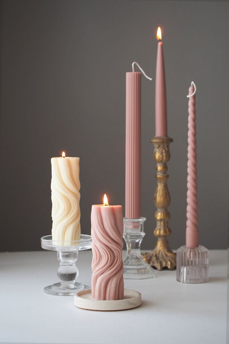 candles are lined up on a table